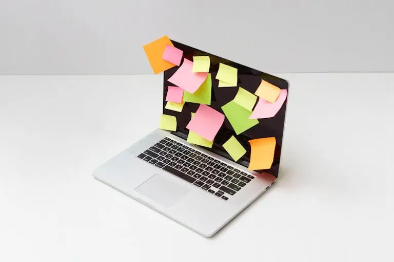 A Laptop with Multicolor Sticky Notes