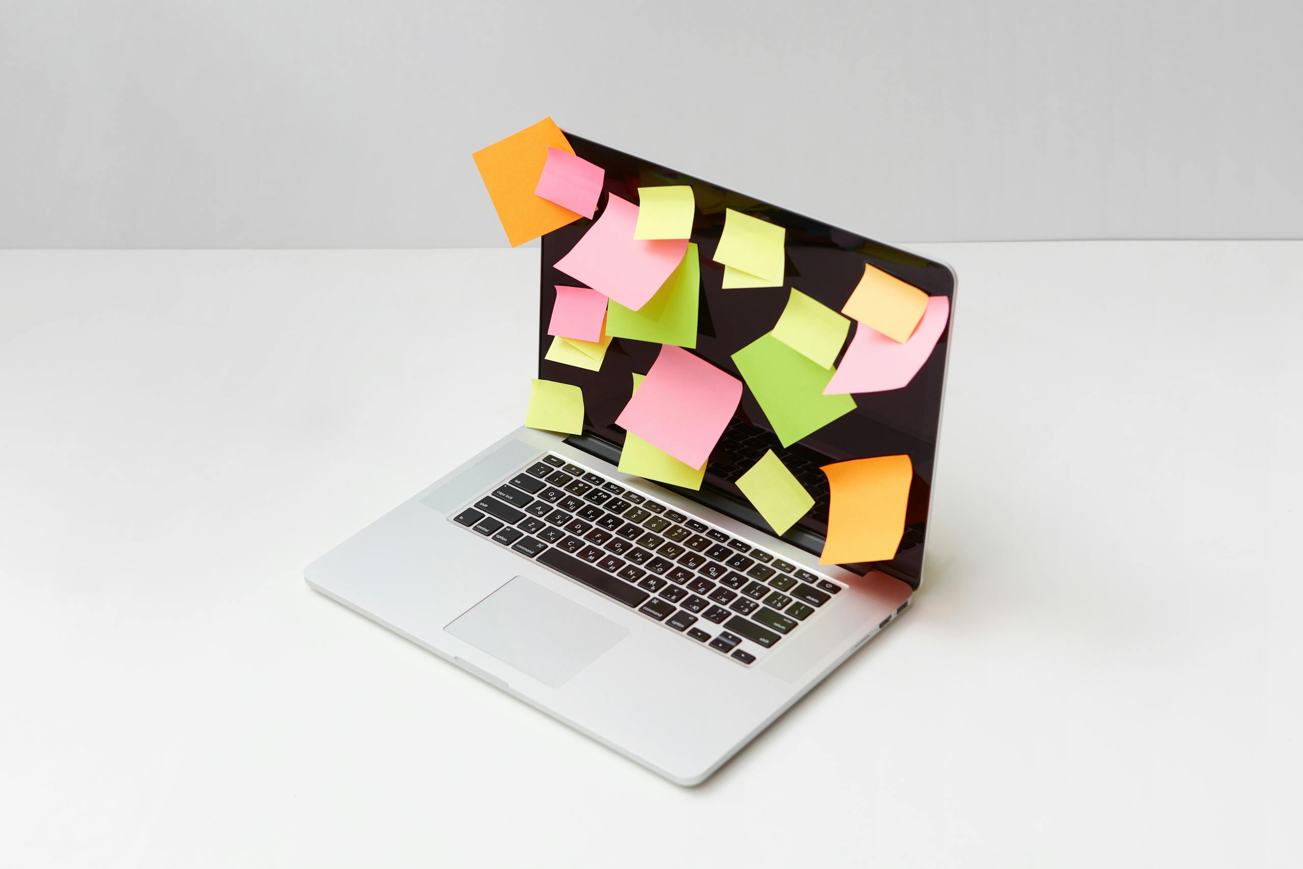 A Laptop with Multicolor Sticky Notes